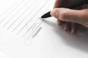 Business Attire Concept Image Prints: Hand signing document with pen