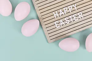 Christian Holiday Tradition Prints: Happy Easter text on letter board with Easter eggs