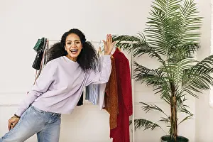 Studio Portrait Photography Prints: Happy stylist posing in studio