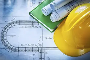 Construction Safety Helmet Prints: Hard hat construction plans notepad on blueprint