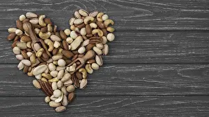Symbolic Heart Image Prints: Heart shape form made from nuts copy space