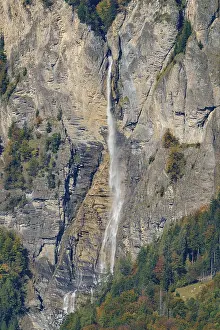 Steep Cliff Landscapes Prints: High waterfall flows over rocky cliffs