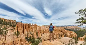Bizarre Landscape Prints: Hiker with backpack in bizarre landscape