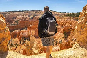 Nature Photography USA Prints: Hiker with a backpack standing on a trail
