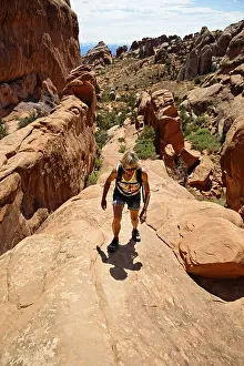 Hiker on a Cliff Print, Arches National Park, Utah