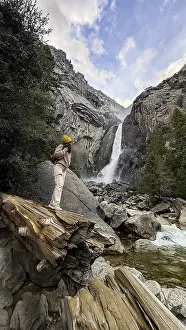 Yosemite National Park Prints: Hiker standing on a fallen log