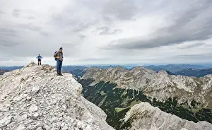 Hiker At Mountain Peak Prints: Hiker at the summit of the eastern Odkarspitze