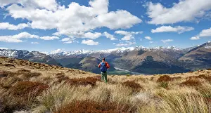 Mountain Peak Photography Prints: Hiker on the summit of Mount Alfred