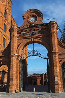 Brick Building Entrance Prints: A historic brick gate with a clock