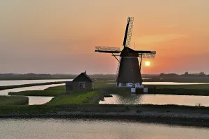 Benelux Countries Landmark Prints: Historic windmill in the light of the setting sun