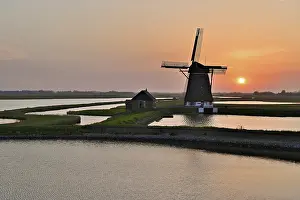 Dutch Smock Mill Prints: Historic windmill in the light of the setting sun