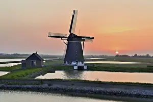 Evening Sun Setting Prints: Historic windmill in the light of the setting sun
