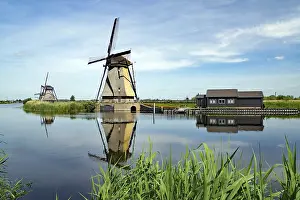 Prints of Historic windmills reflected in a canal, Unesco World Heritage Site, Kinderdyk, Molenlanden municipality, Netherlands Heritage Site Prints: Historic Windmills Print, Kinderdyk, Netherlands