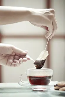 Deserted Breakfast Scene Prints: Human hands making tea