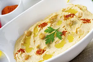 Hummus Paste Prints: Hummus paste with lemon and chilli on a white background