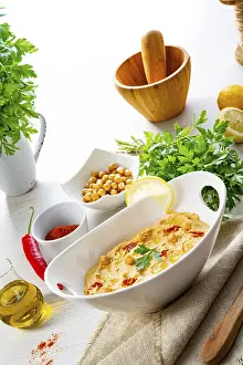 Healthy Snack Ideas Prints: Hummus paste with lemon and chilli on a white background