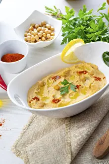 Hummus Paste Prints: Hummus paste with lemon and chilli on a white background
