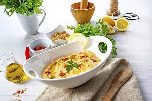 Hummus With Lemon And Chilli Prints: Hummus paste with lemon and chilli on a white background