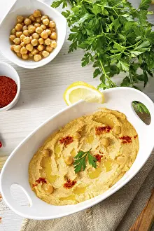 Hummus Paste Prints: Hummus paste with lemon and chilli on a white background