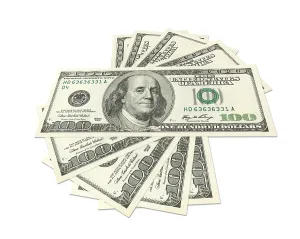 Studio Shot Currency Prints: Hundreds of dollars spread on white background