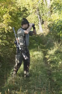 Daytime Hunting Scene Prints: Hunter observing quarry