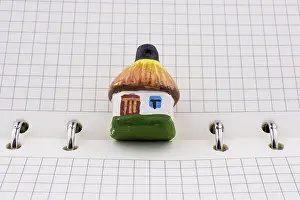 Office Supply Desk Utensils Prints: Hut model on a spiral notebook