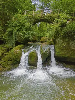 Benelux Countryside Scenery Prints: An idyllic waterfall flows under a rustic bridge