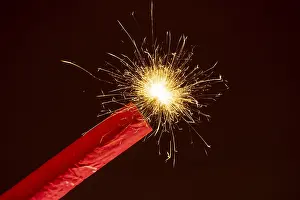 Deserted Fire Scene Prints: Ignited firework, firecracker, firecracker with burning fuse