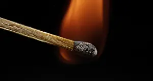 Igniting Match Prints: Igniting Match against Black background