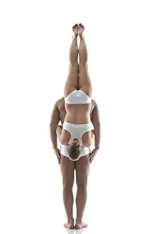 Young Couple Dance Prints: Image of acrobatic duo balancing in studio
