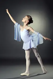 Elegant Pose Prints: Image of graceful little dancer posing on gray backdrop