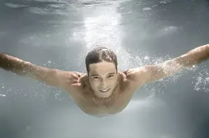 One Person Swimming Prints: An image of a man diving in a pool