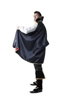 Carnival Costume Prints: Image of man dressed as illusionist posing at camera