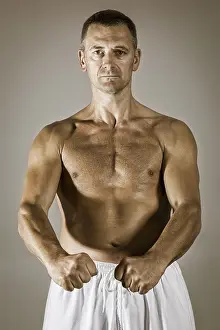 Studio Shot Of A Warrior Prints: An image of a middle age taekwondo fighter in basic position