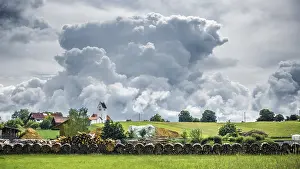 Gloomy Weather Germany Prints: An image of a storm cloud over Frieding Bavaria Germany