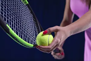 Sports Concept Image Prints: Image of a tennis ball on the background of the strings of the racket
