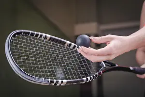 Sportswear Clothing Prints: Image of a woman's hand with a squash racket