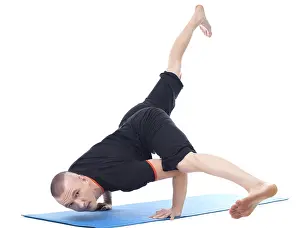 Gymnastics Training Photos Prints: Image of yogi posing in studio looking at camera