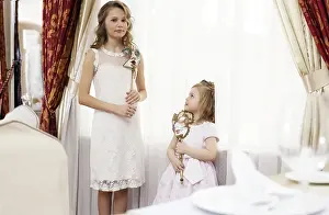 Young Sisters Prints: Image of two young nice sisters posing at camera