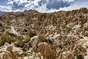 Prints of Impressive eroded landscape under dramatic sky with cloudy horizon, The Valle de la Luna Moon Valley near La Paz in Bolivia Bolivia Prints: Impressive Eroded Landscape Print: Valle de la Luna Bolivia