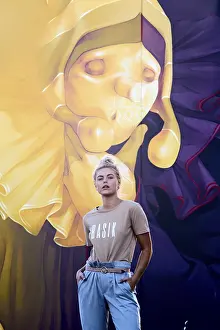 Prints of Individual stands confidently against a large, colorful mural, dressed casually in an urban area, stylish, fashionable woman, chic, trendy, in vogue, wistful, desireful, women's fashion, female Contemporary Art Prints: Urban Chic Woman Print