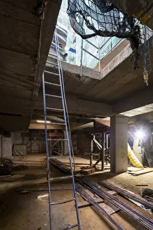 Construction Progress Prints: An indoor construction site with essential elements like ladders