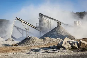 Open Pit Mining Prints: Industrial background, crusher rock stone crushing machine at open pit mining and processing plant for crushed stone