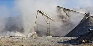 Raw Material Extraction Site Prints: Industrial background, crusher rock stone crushing machine at open pit mining and processing plant for crushed stone