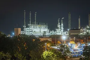 Prints of Industrial end at night with illuminated chimneys and warehouse buildings surrounded by trees and streetlights, Mannheim, Germany Mannheim Prints: Industrial End at Night Print, Mannheim Germany