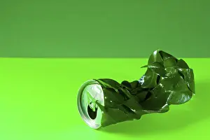 Environmentally Friendly Products Prints: Infolded can with green leafs; concept for recycling