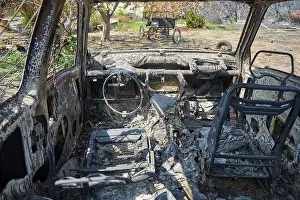 Forest Fire Damage Greece Prints: Interior of a burnt car, completely devastated and charred