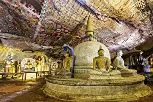 Buddhist Rock Cut Temple Prints: Interior of a cave with Buddha statues