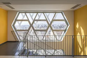Contemporary Building Style Prints: Interior of a modern auditorium with a unique hexagonal window design