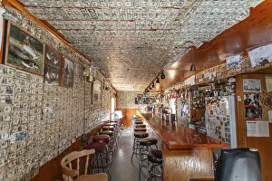 US Dollar Banknote Prints: Interior shot of a pub lined with dollar notes